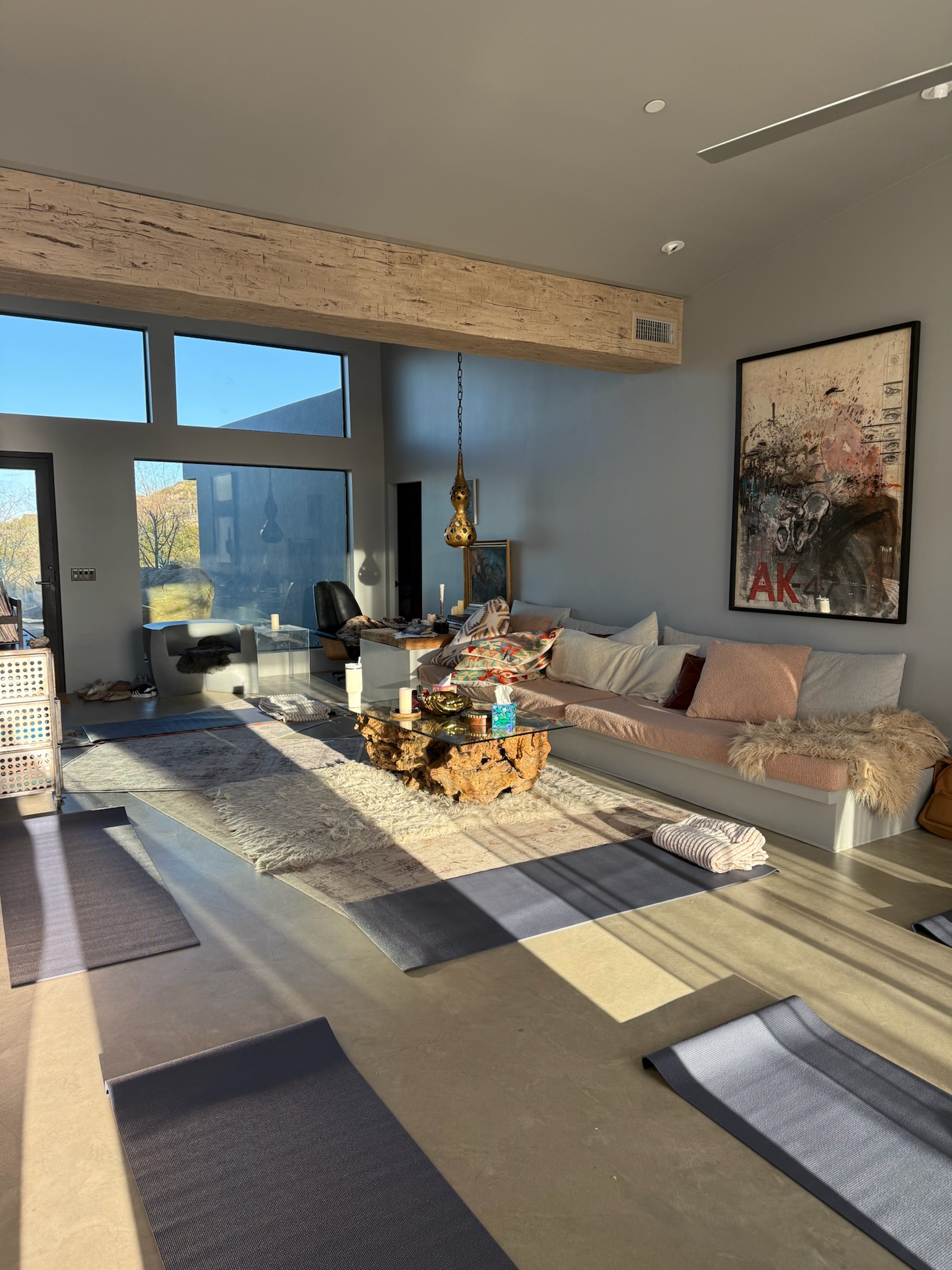 Sunlit retreat living room with blankets and seating