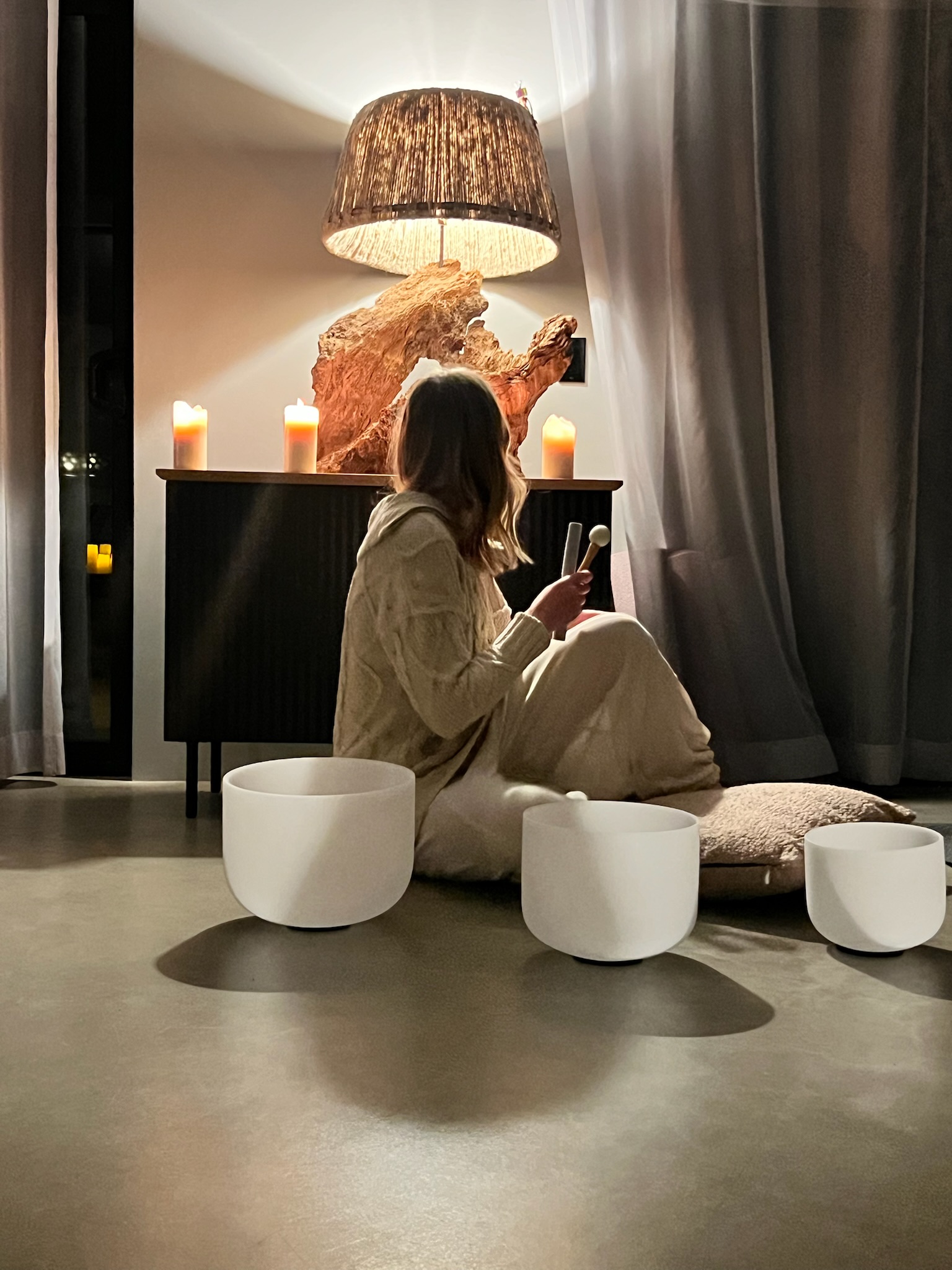 Candlelit quiet moment inside a retreat space